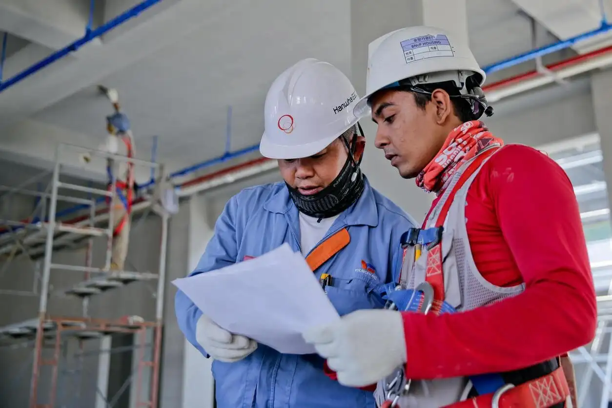 Two workers working at Gitanjali-Gitabitan site